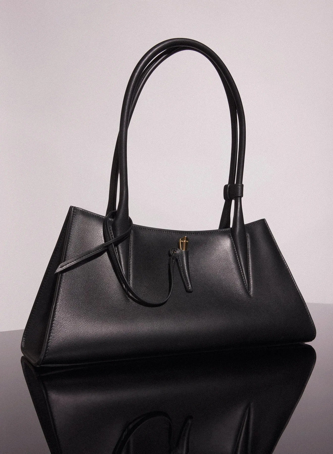 black smooth leather fang bag