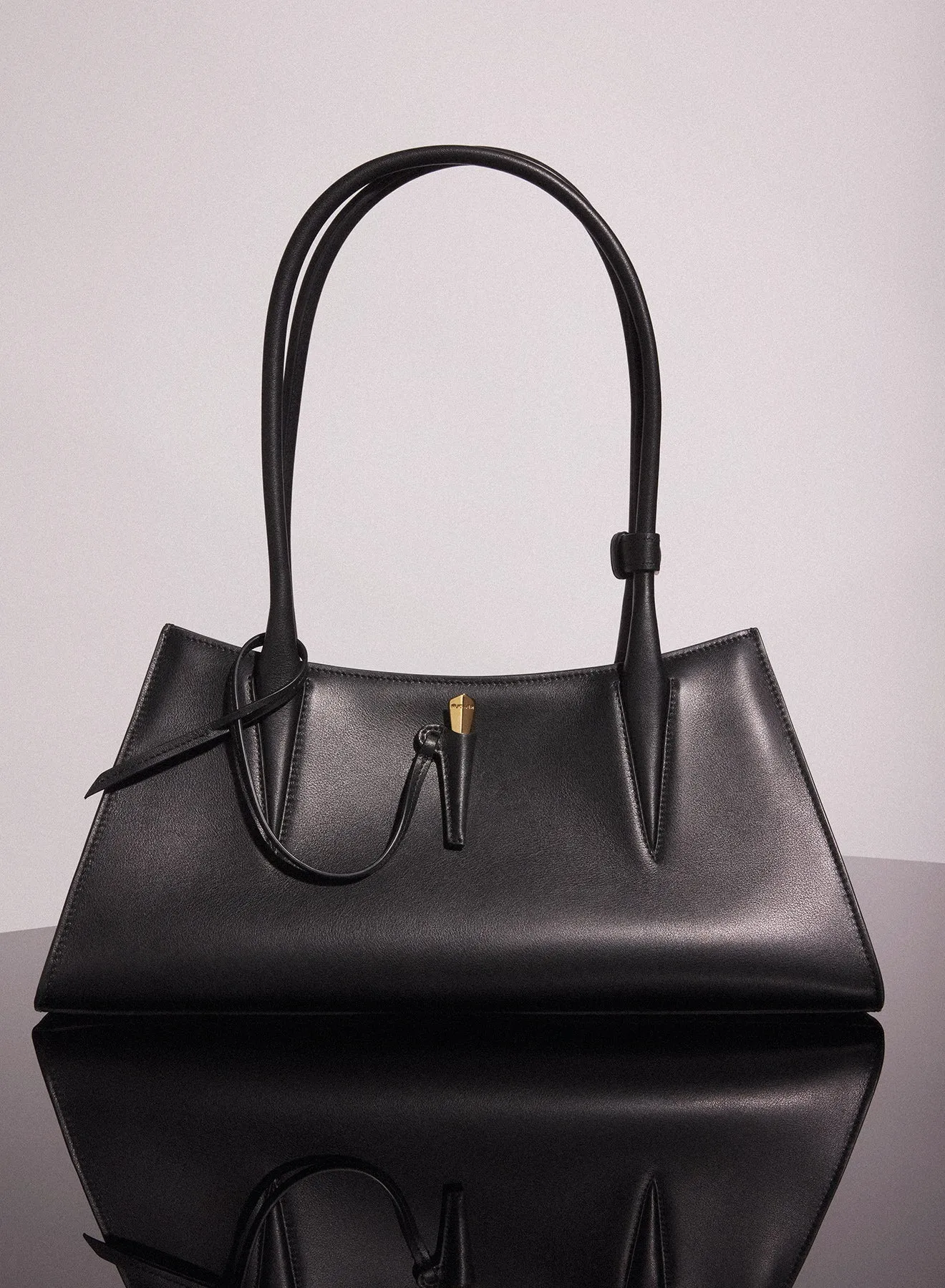 black smooth leather fang bag