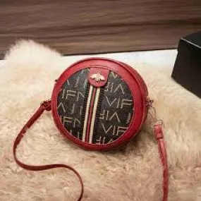 Leather elegant round waterproof ladies sling bag.